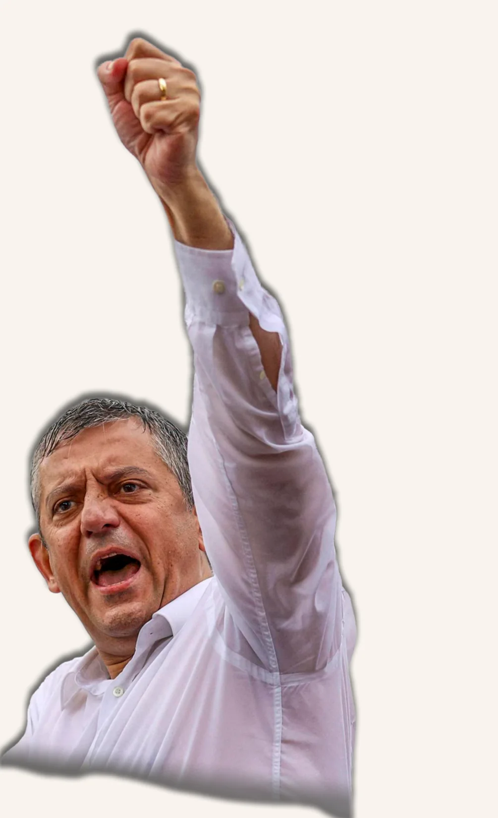 CHP leader Özgür Özel raises his fist while standing atop a police water cannon.